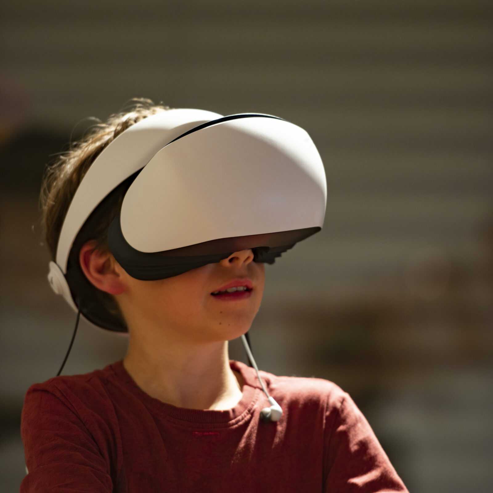 Child with a Virtual reality headset on his eyes