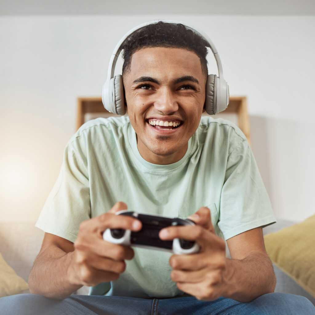 happy-game-controller-and-man-with-headphones-li-2025-04-06-09-05-57-utc